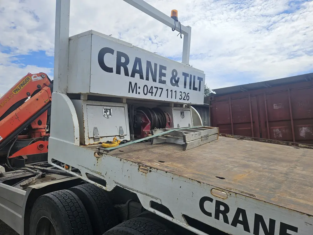 Tilt tray and crane equipment ready for transport
